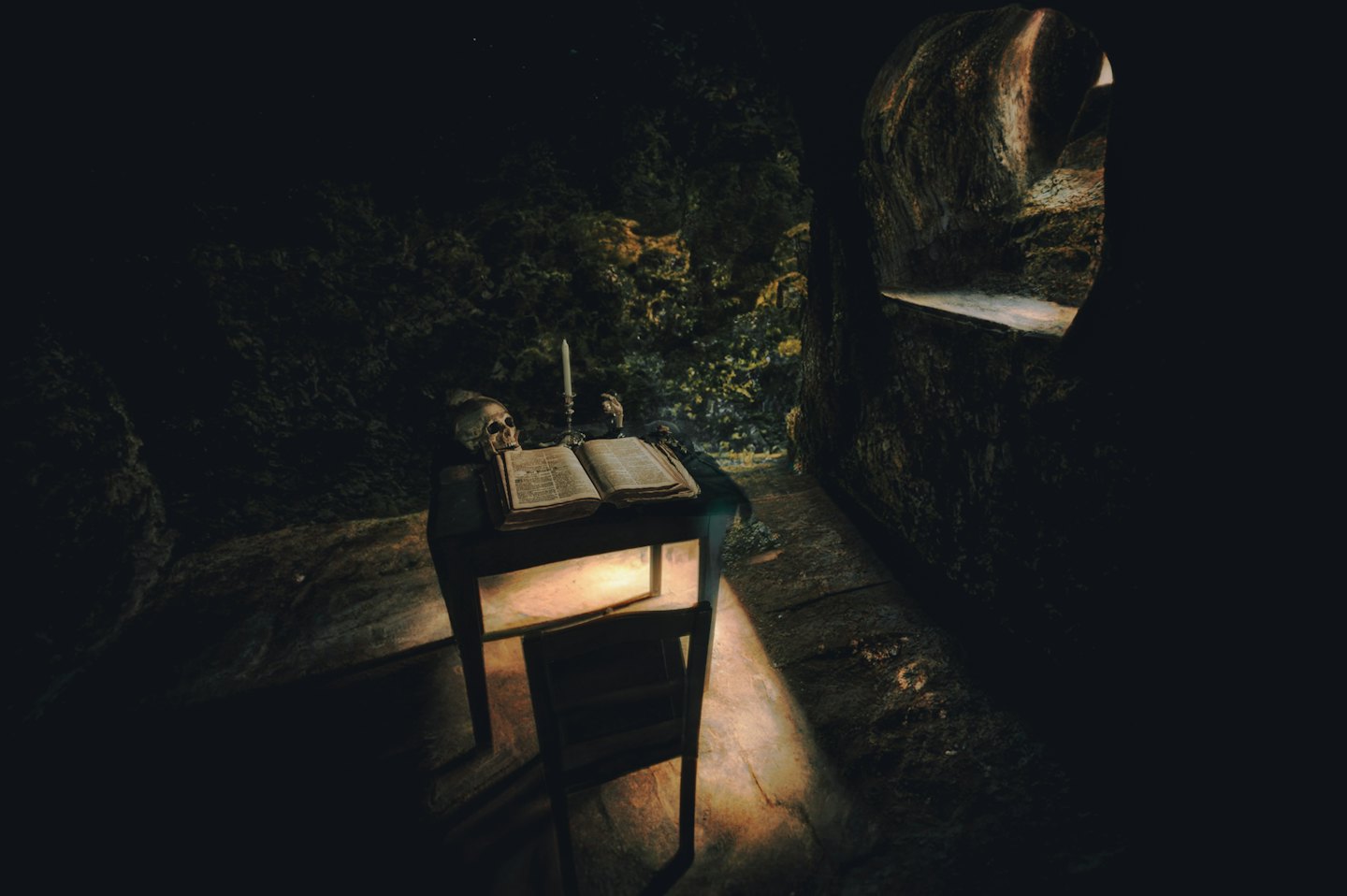 Aged book and skull on a wooden table.